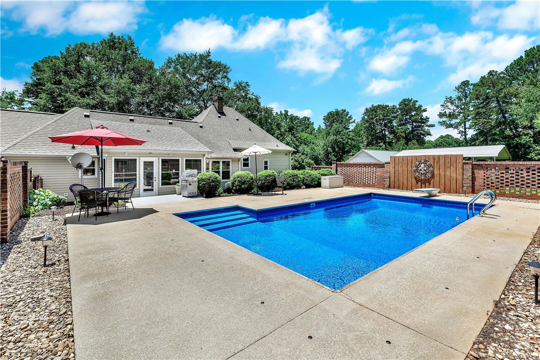 910 Chantilly Lane Anderson, SC 29625 - Photo 32 of 38 An inviting backyard oasis offers a pristine inground pool for endless summer enjoyment.