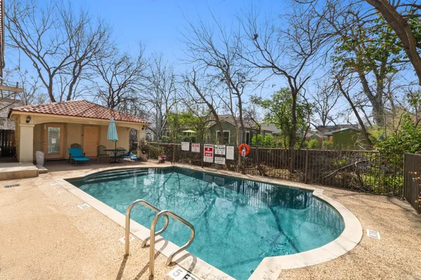 a view of a swimming pool with a patio