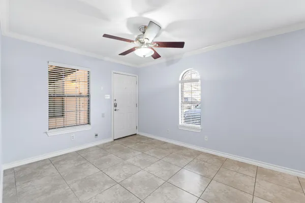 a view of an empty room with a window