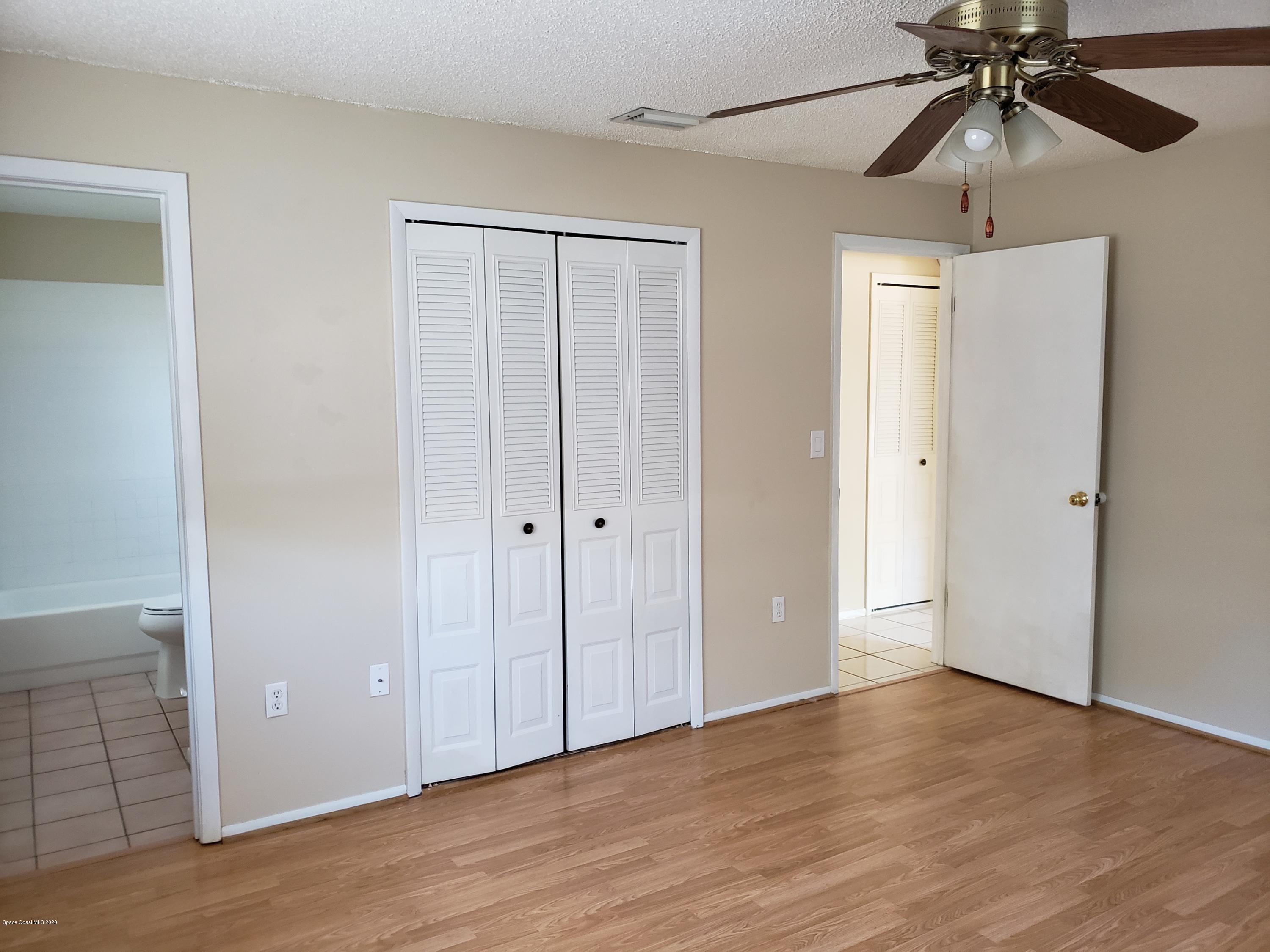 284 Jablo Avenue Cocoa, FL 32927 - Photo 15 of 20 a view of an empty room and wooden floor closet area