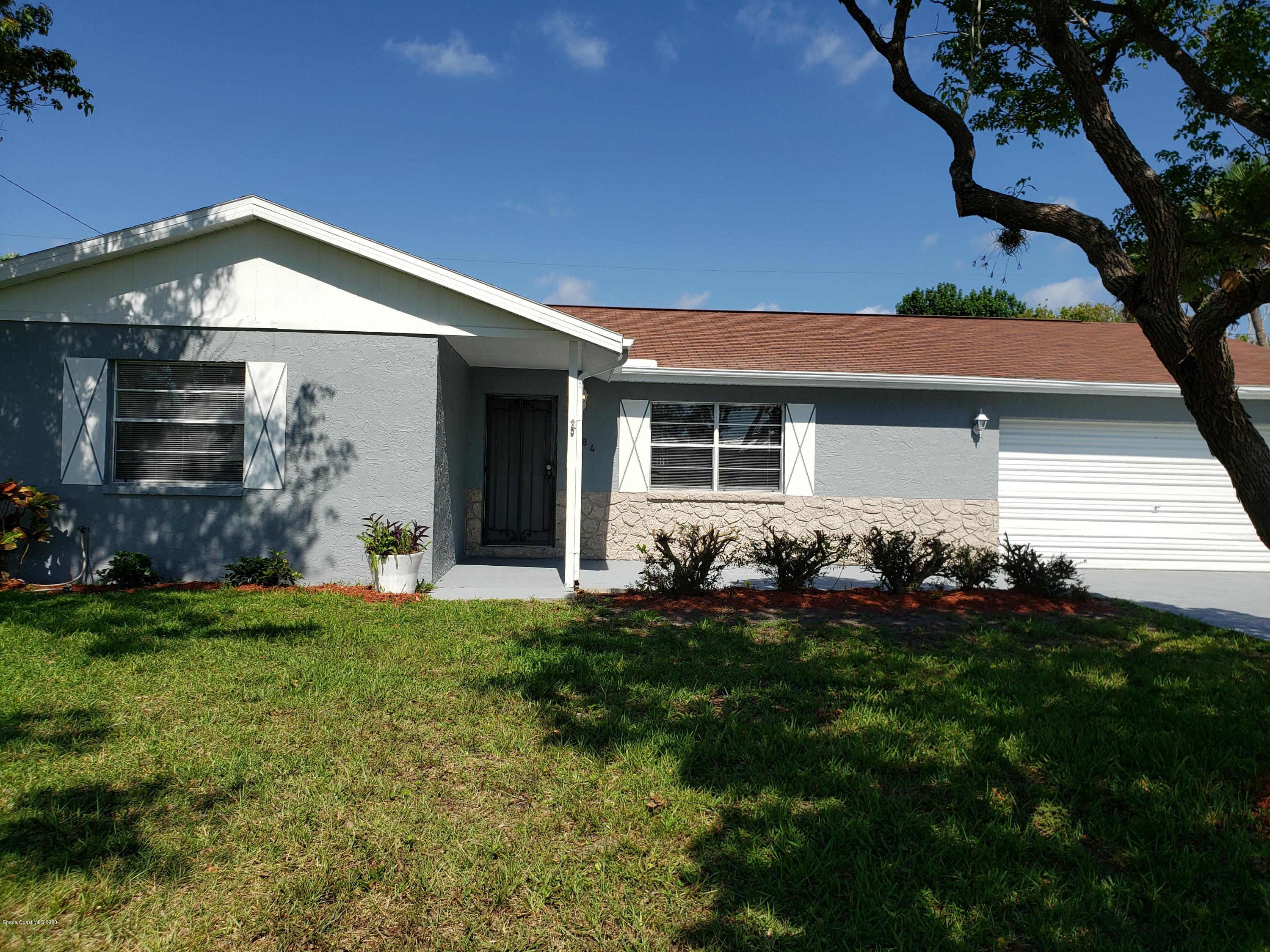 284 Jablo Avenue Cocoa, FL 32927 - Photo 3 of 20 a front view of house with a garden