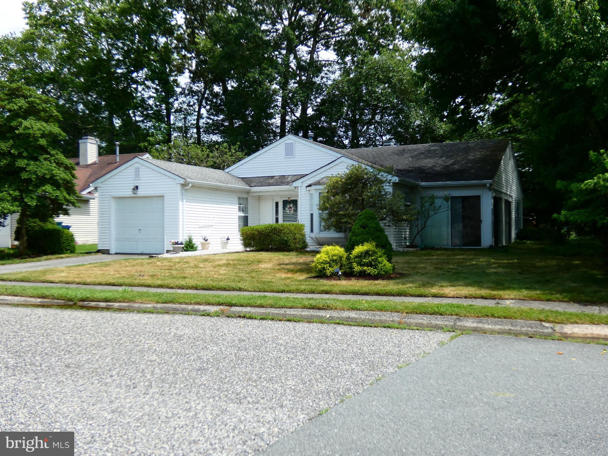 227 Lantern Place Tuckerton, NJ 08087 - Photo 2 of 33 a front view of a house with a yard