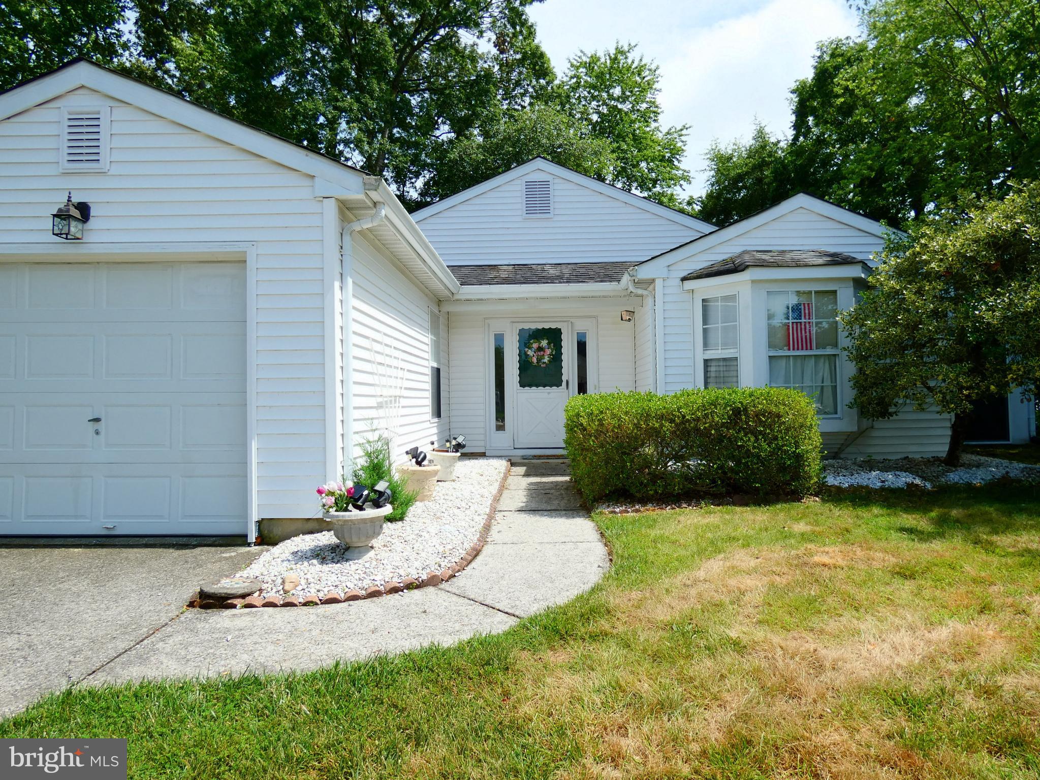 227 Lantern Place Tuckerton, NJ 08087 - Photo 4 of 33 a view of a house with a yard and potted plants