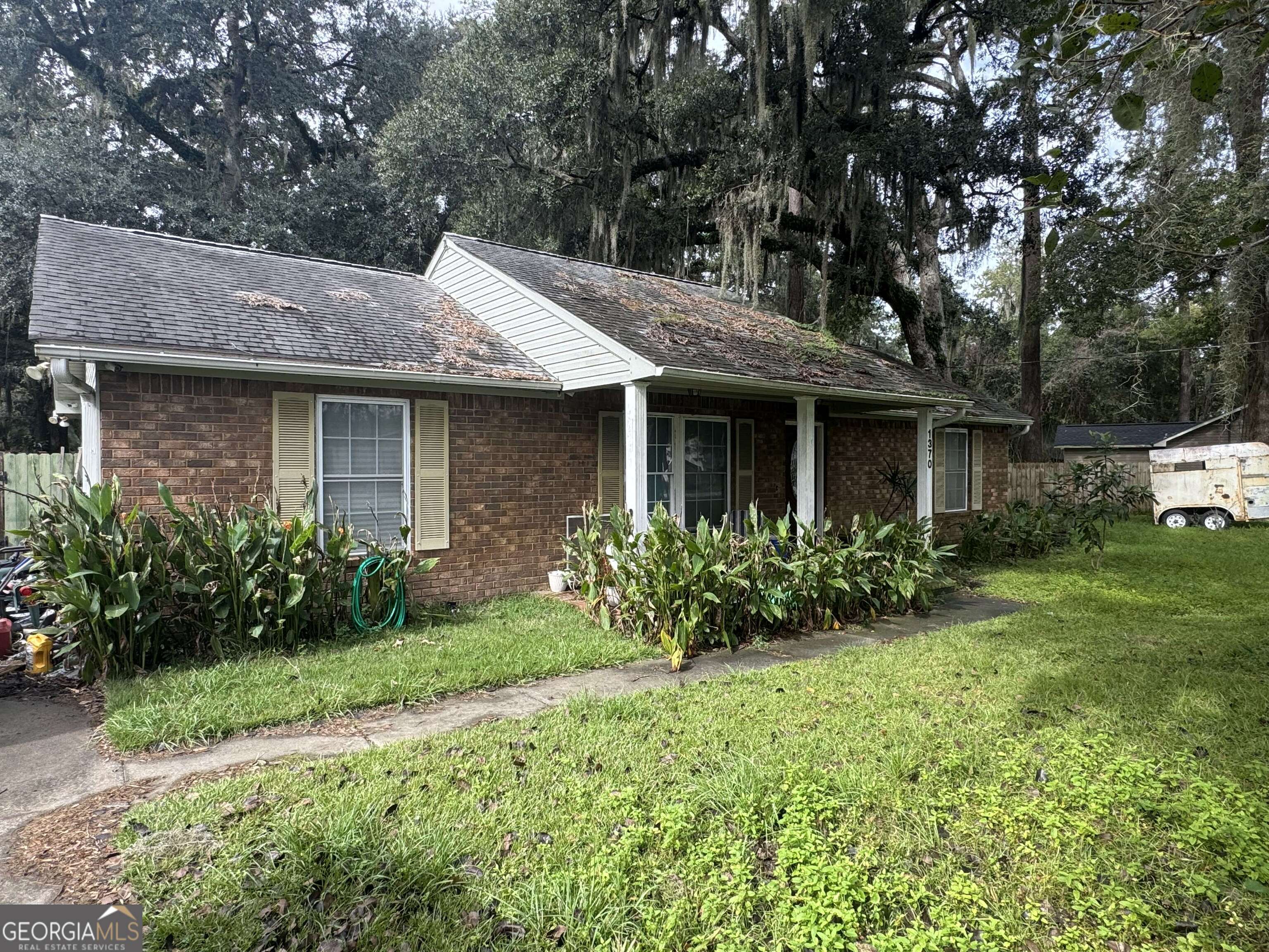 a front view of a house with garden