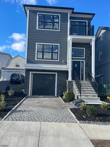 a front view of a house with yard