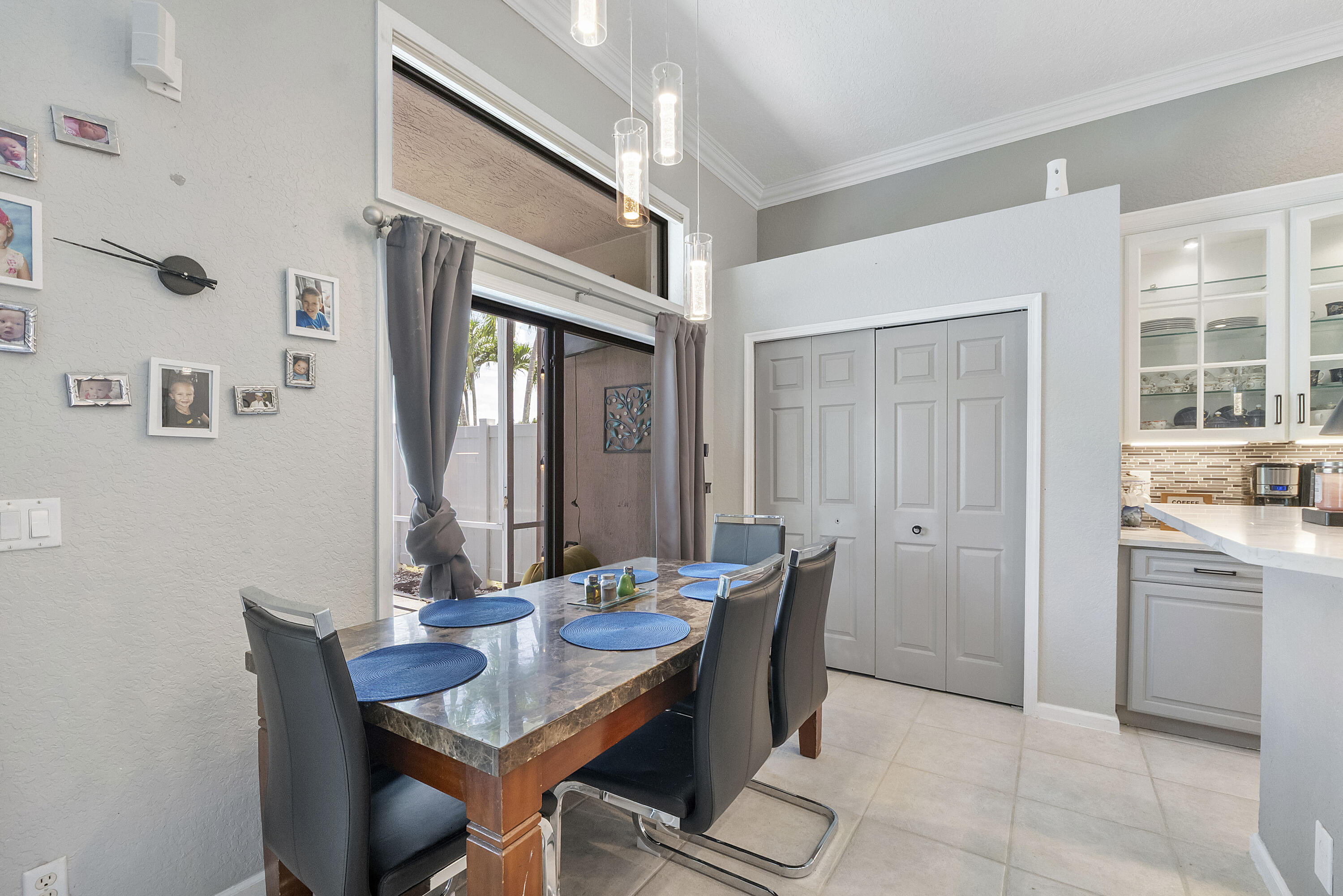 12328 St Simon Drive Boca Raton, FL 33428 - Photo 11 of 52 a view of a dining room with furniture and window