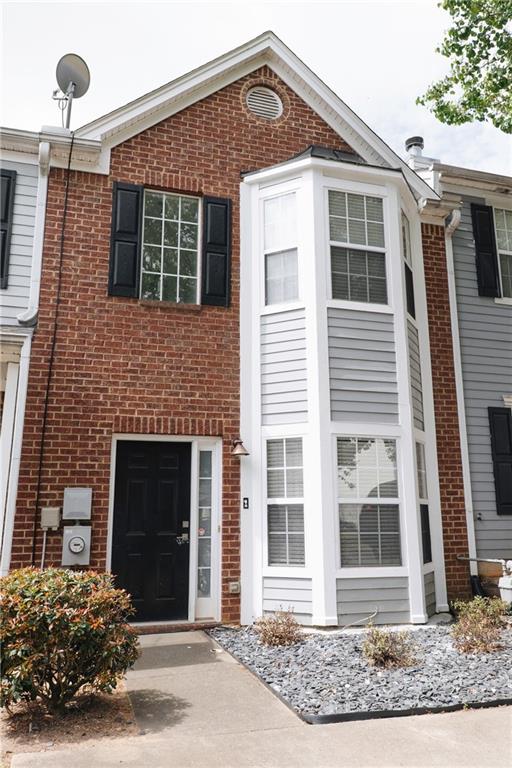 340 Timber Gate Court Lawrenceville, GA 30045 - Photo 1 of 26 a front view of a house with a yard
