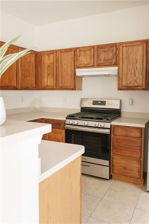 340 Timber Gate Court Lawrenceville, GA 30045 - Photo 11 of 26 a kitchen with a stove and a cabinets