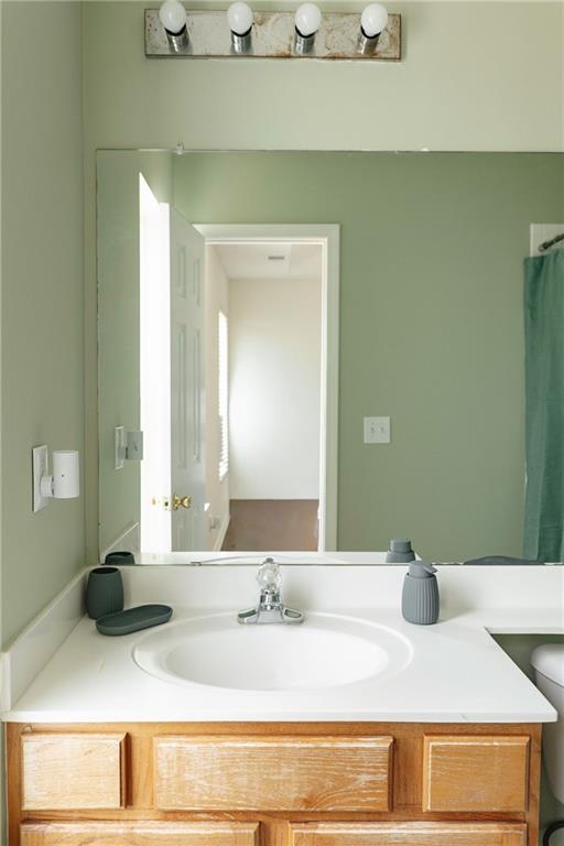 340 Timber Gate Court Lawrenceville, GA 30045 - Photo 17 of 26 a bathroom with a sink and a mirror