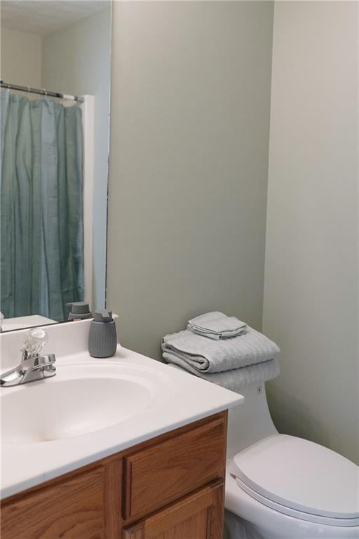 340 Timber Gate Court Lawrenceville, GA 30045 - Photo 24 of 26 a bathroom with a sink a toilet and shower