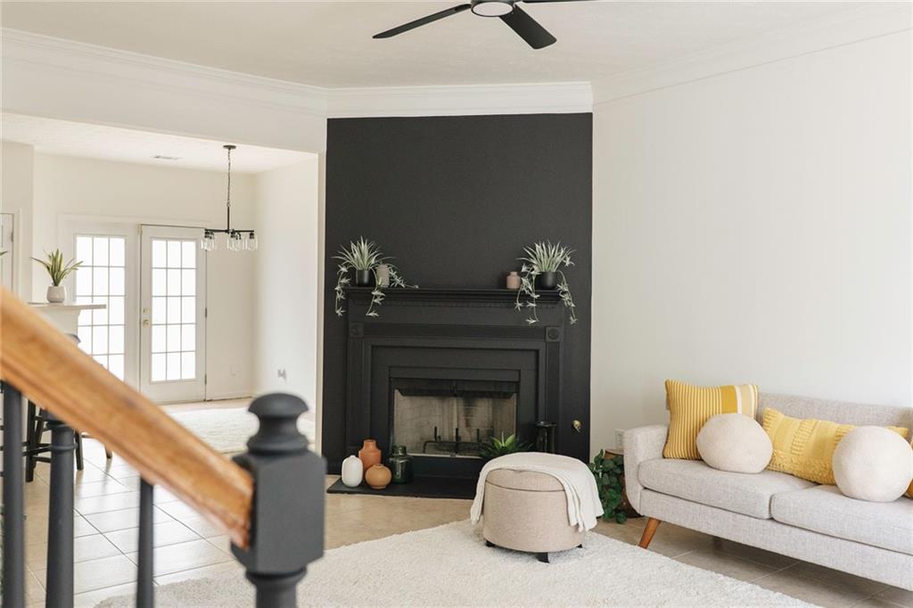 340 Timber Gate Court Lawrenceville, GA 30045 - Photo 6 of 26 a living room with furniture a window and a fireplace