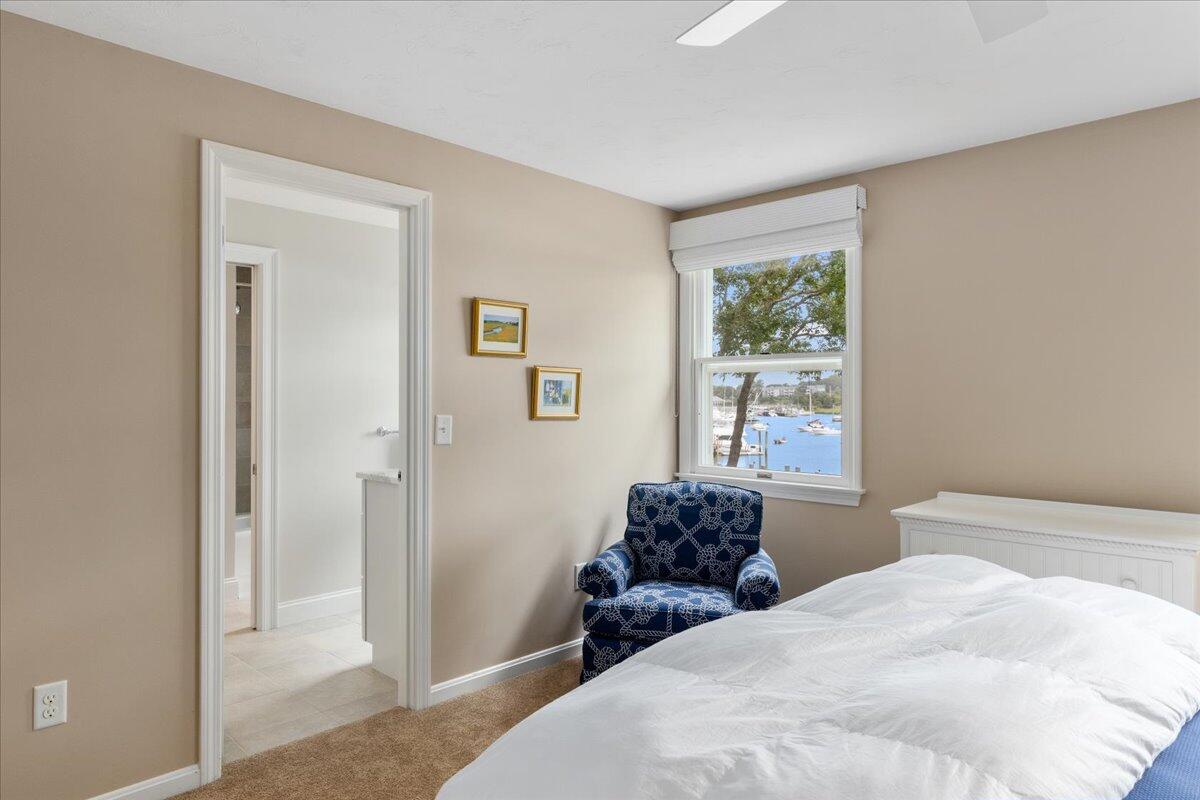 25 Nons Road Harwich Port, MA 02646 - Photo 54 of 80 a bedroom with a bed and wooden floor