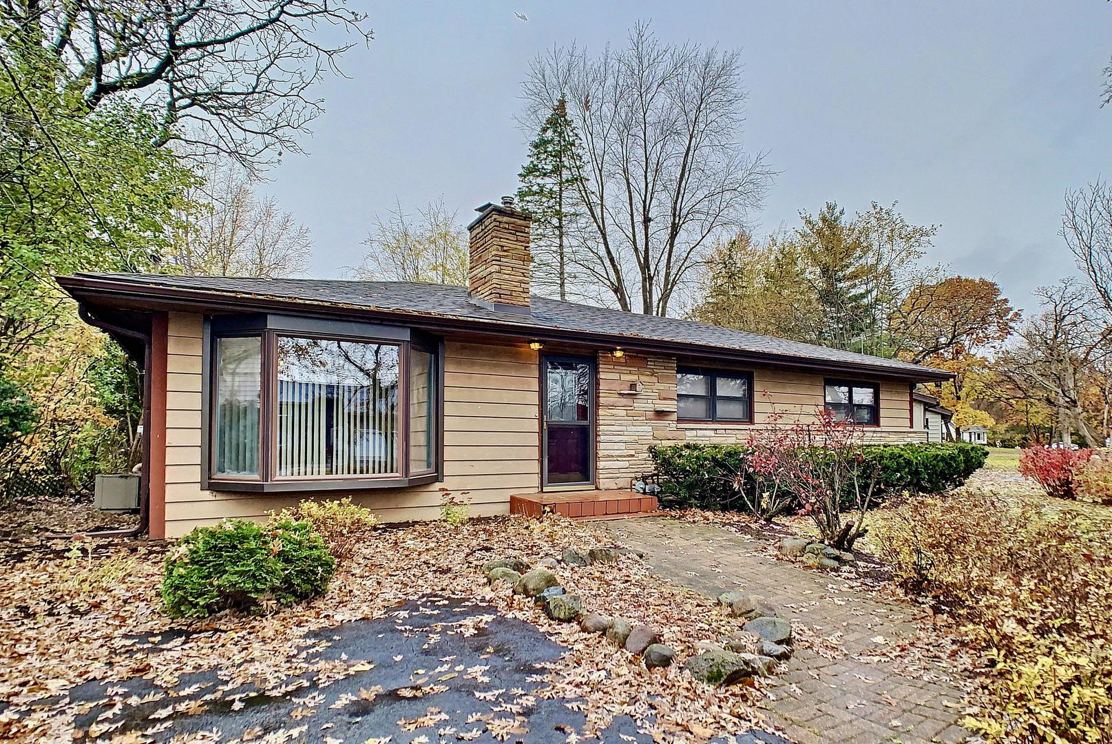 4705 Timberlane Road Crystal Lake, IL 60014 - Photo 1 of 29 a front view of a house with garden