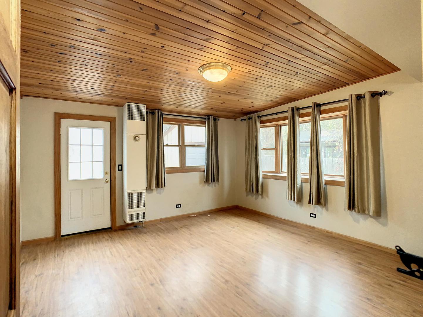4705 Timberlane Road Crystal Lake, IL 60014 - Photo 12 of 29 an empty room with windows