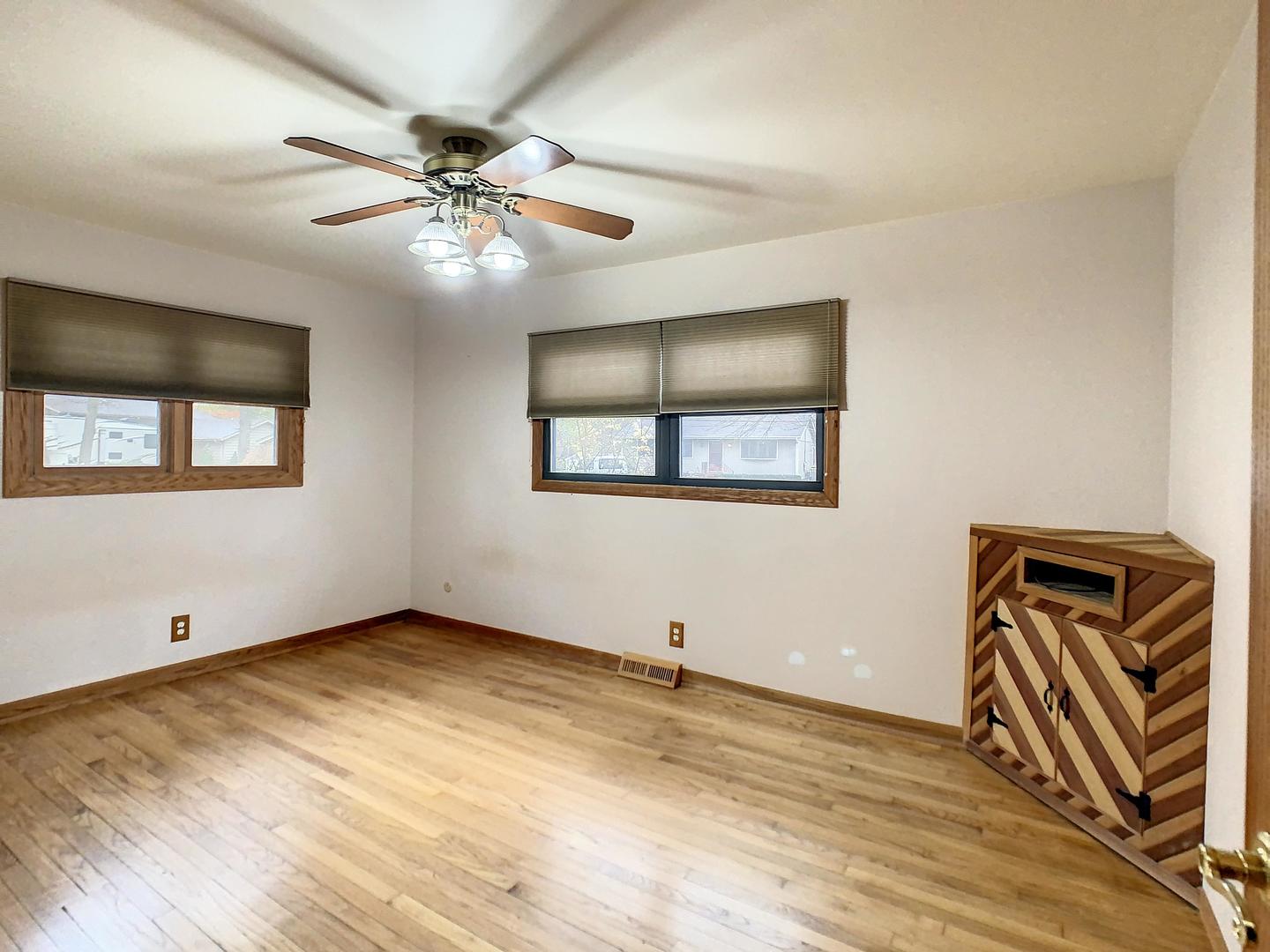 4705 Timberlane Road Crystal Lake, IL 60014 - Photo 19 of 29 a view of an empty room with window and wooden floor