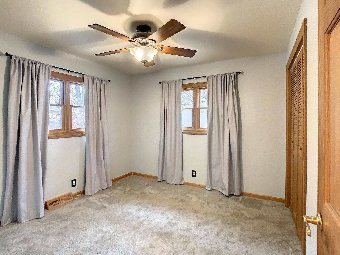 4705 Timberlane Road Crystal Lake, IL 60014 - Photo 25 of 29 an empty room with windows and fan