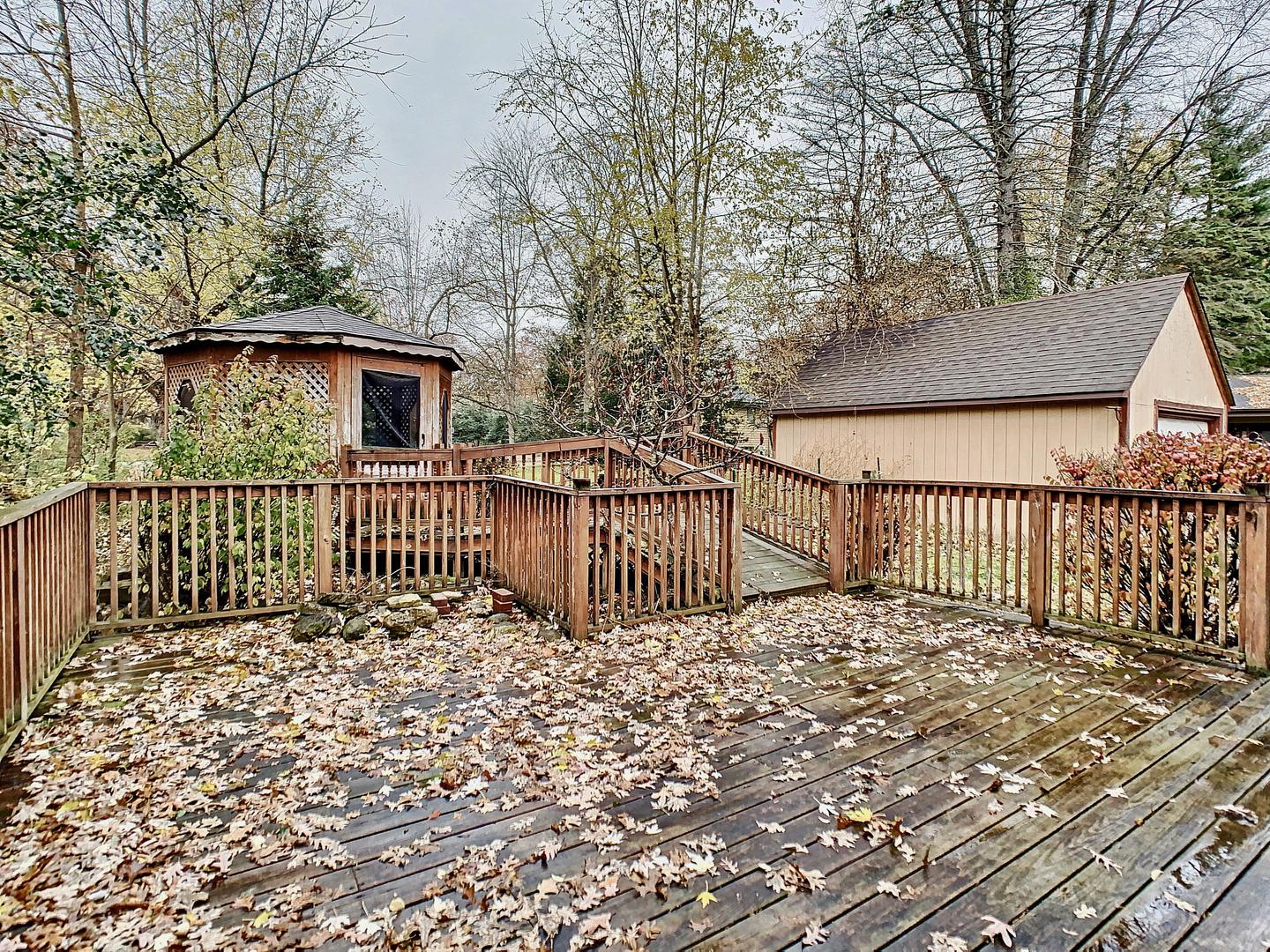 4705 Timberlane Road Crystal Lake, IL 60014 - Photo 29 of 29 a side view of a house with a fence