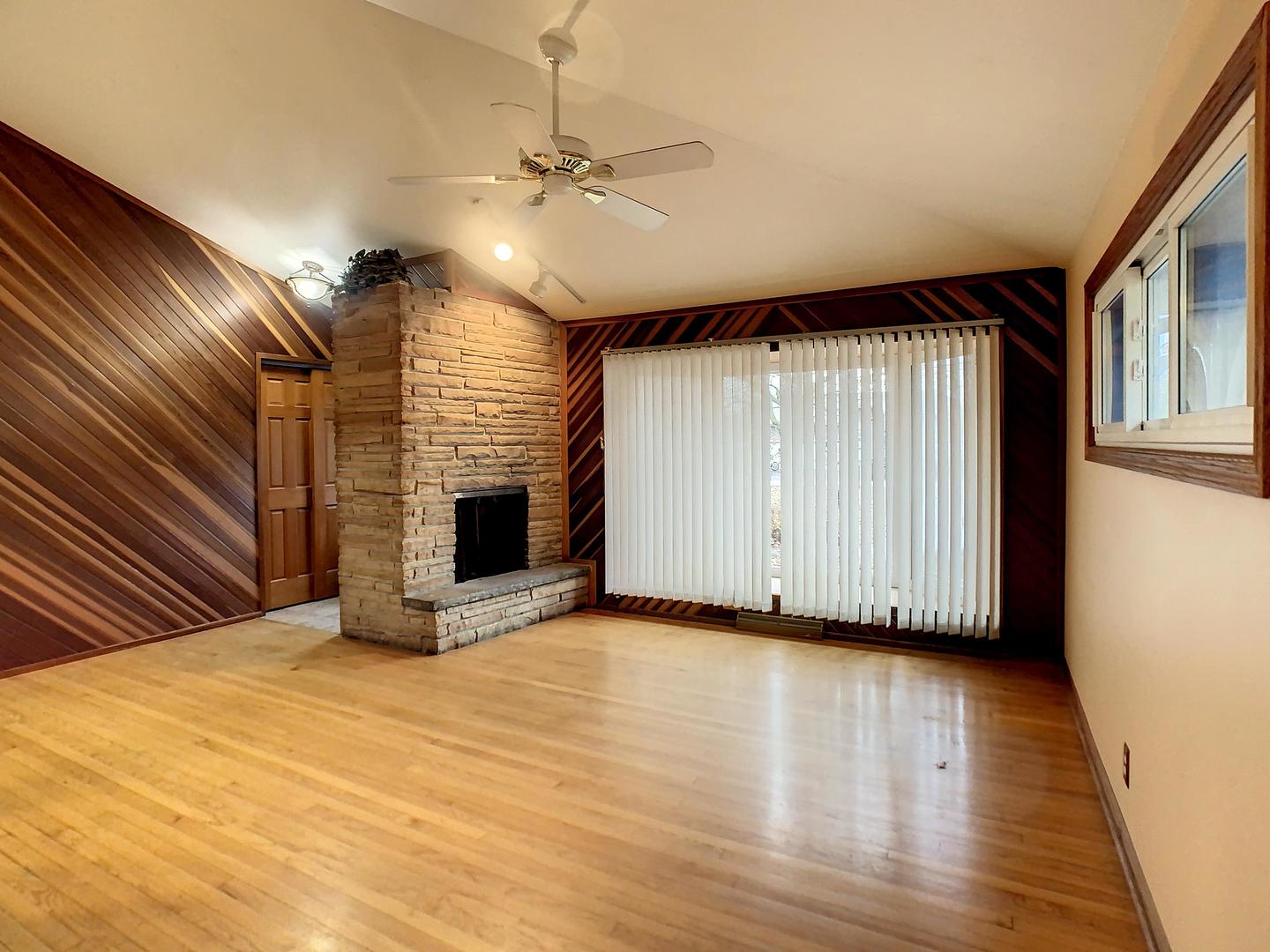 4705 Timberlane Road Crystal Lake, IL 60014 - Photo 4 of 29 a view of an empty room with a fireplace and a window