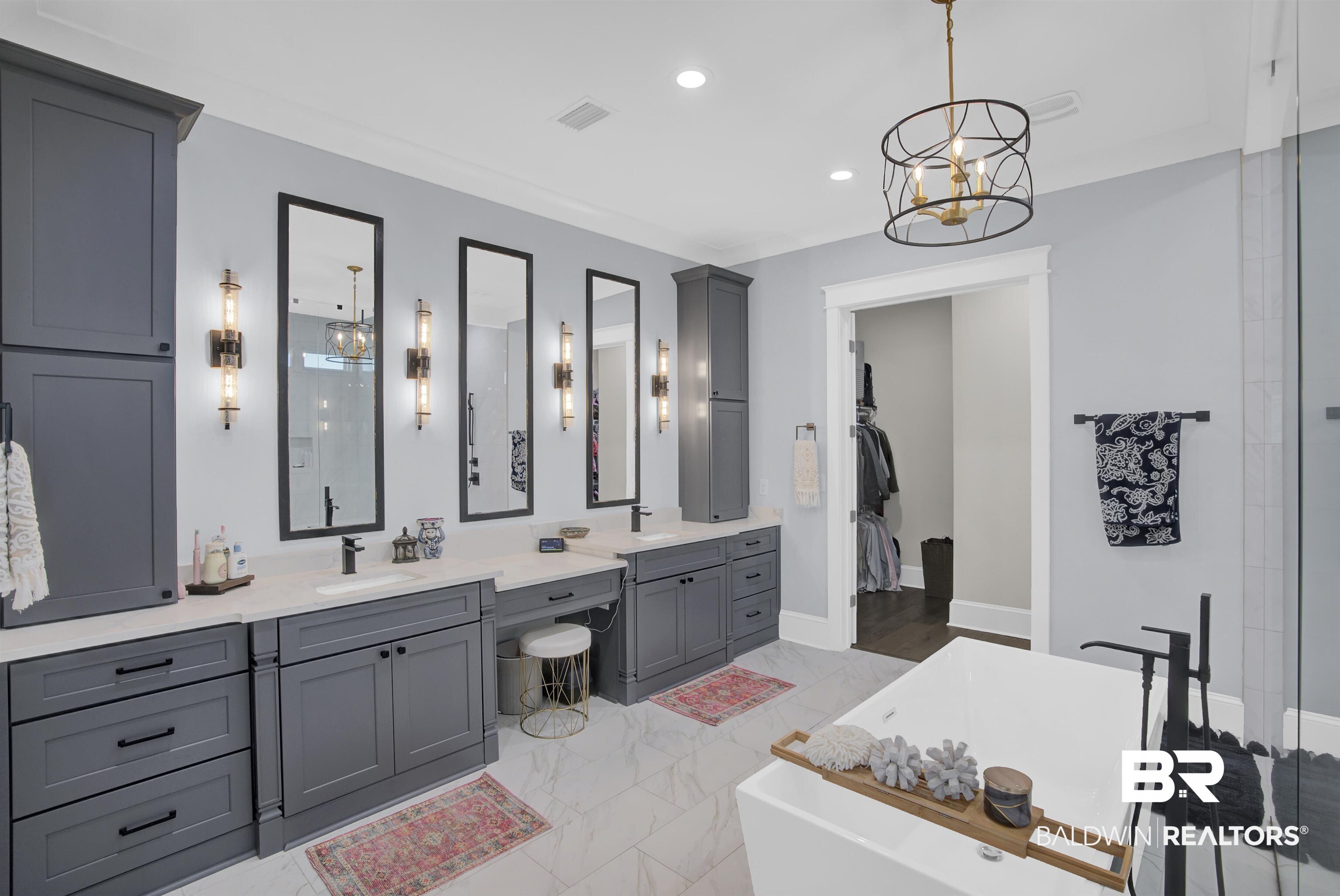 10940 Atrium Avenue Fairhope, AL 36532 - Photo 24 of 43 Bathroom featuring a washtub, vanity, and a chandelier