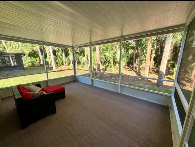 a room with furniture and a flat screen tv