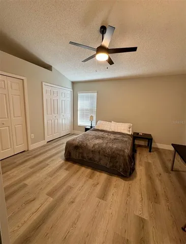a bedroom with a bed and dresser