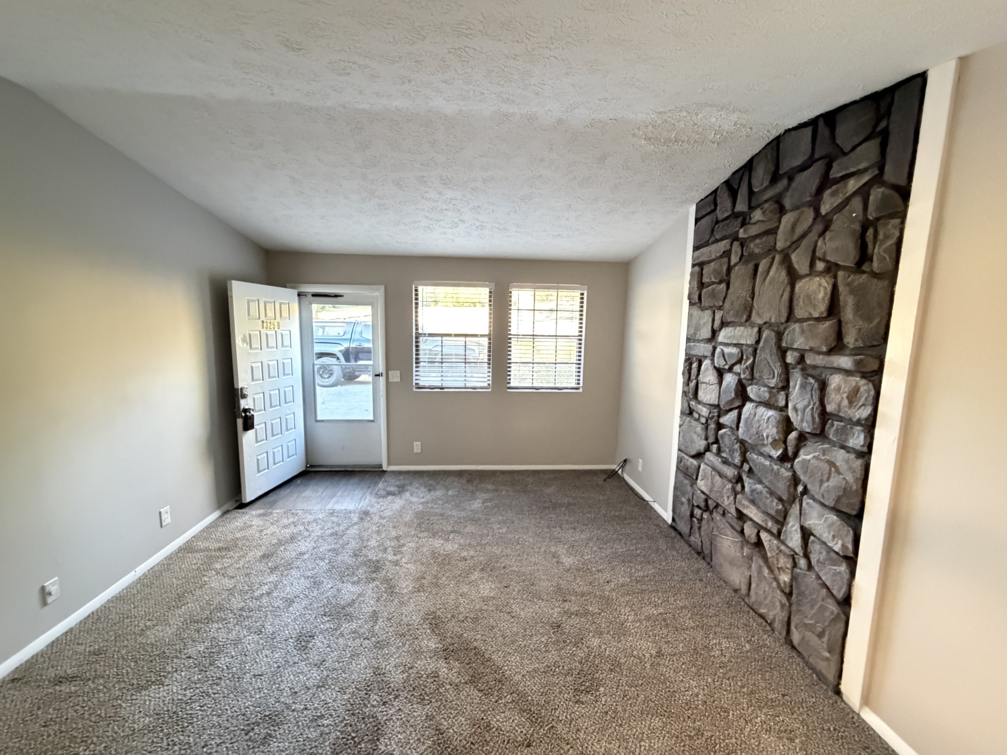 1325 Ardee Avenue, Unit B Nashville, TN 37216 - Photo 3 of 13 an empty room with windows and closet