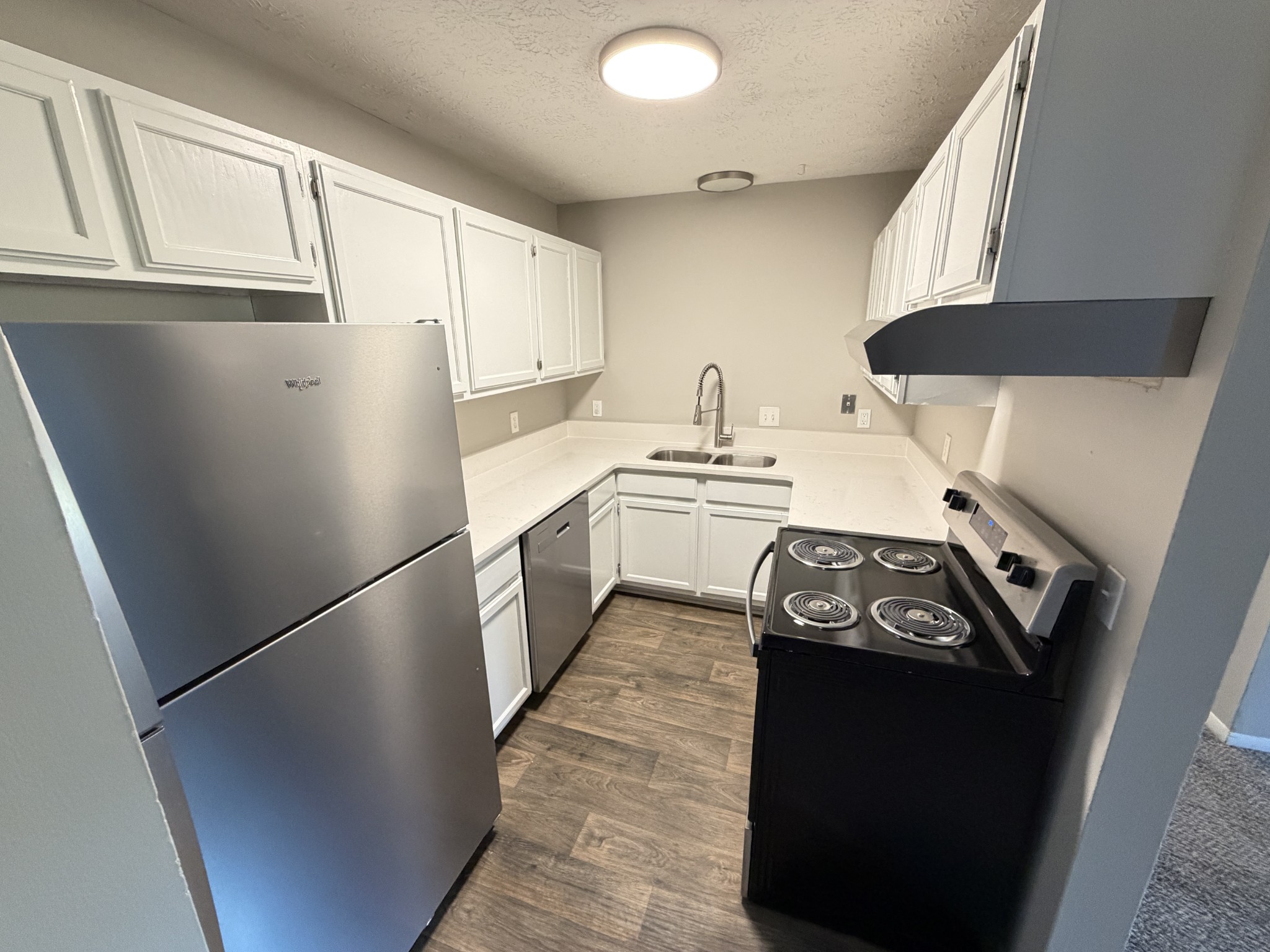 1325 Ardee Avenue, Unit B Nashville, TN 37216 - Photo 5 of 13 a kitchen with a stove a refrigerator and a sink