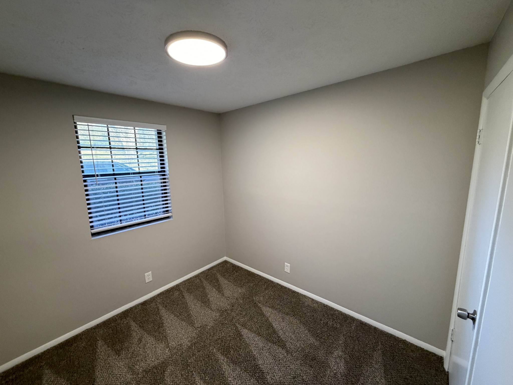 1325 Ardee Avenue, Unit B Nashville, TN 37216 - Photo 8 of 13 an empty room with a window