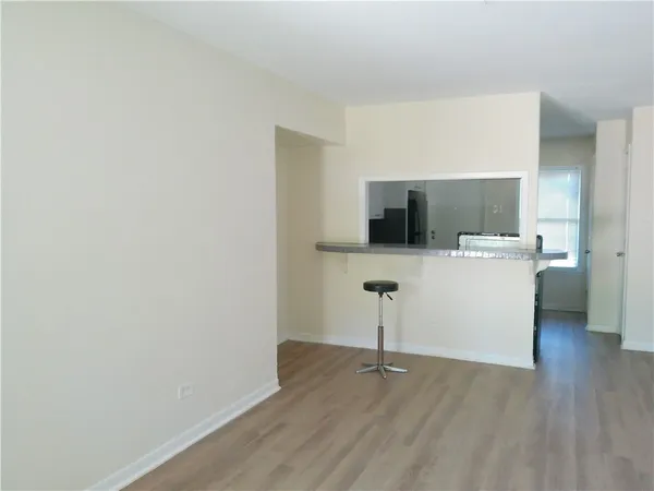 a kitchen with stainless steel appliances granite countertop a stove and a refrigerator
