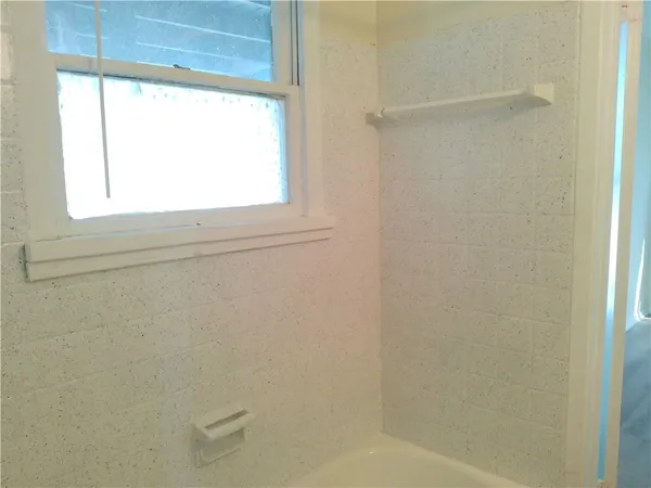 a bathroom with a sink mirror and vanity