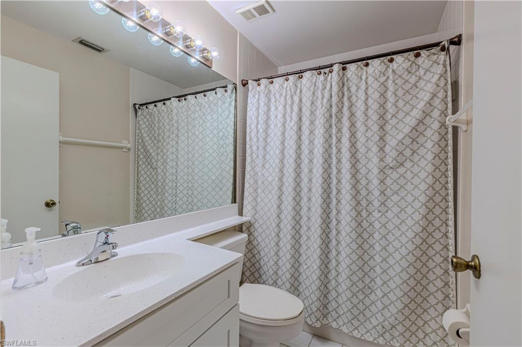 7761 Jewel Lane, Unit 202 Naples, FL 34109 - Photo 11 of 27 Bathroom featuring toilet and vanity