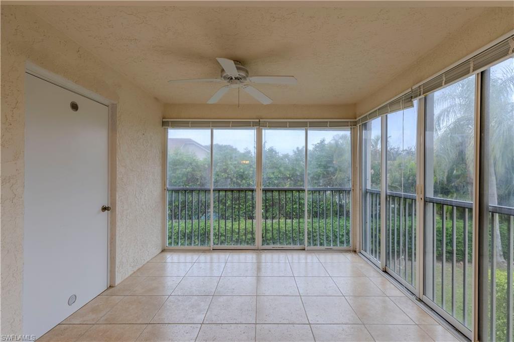7761 Jewel Lane, Unit 202 Naples, FL 34109 - Photo 15 of 27 Unfurnished sunroom featuring ceiling fan