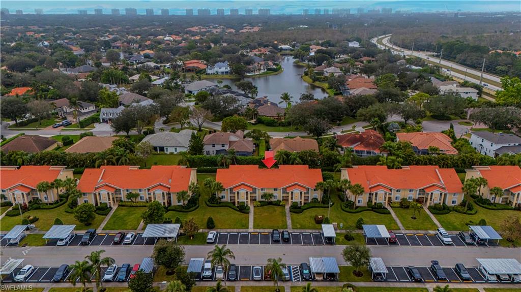 7761 Jewel Lane, Unit 202 Naples, FL 34109 - Photo 21 of 27 Birds eye view of property featuring a water view