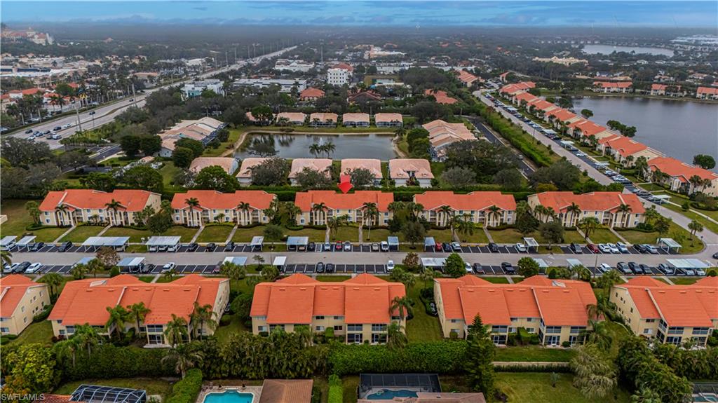 7761 Jewel Lane, Unit 202 Naples, FL 34109 - Photo 22 of 27 Drone / aerial view with a water view