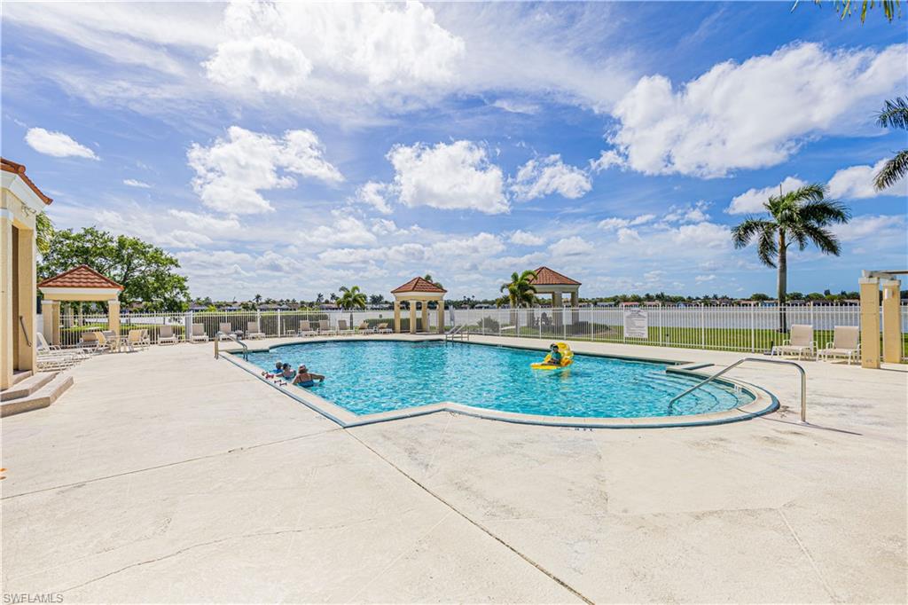 7761 Jewel Lane, Unit 202 Naples, FL 34109 - Photo 23 of 27 View of swimming pool featuring a gazebo and a patio