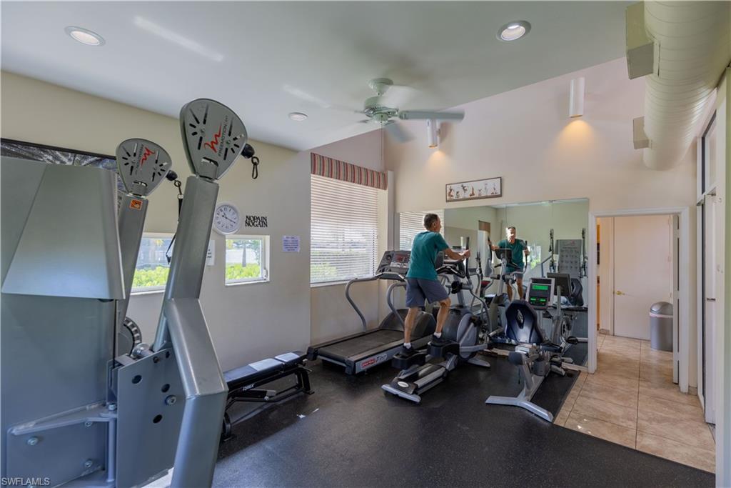 7761 Jewel Lane, Unit 202 Naples, FL 34109 - Photo 24 of 27 Gym with ceiling fan and a wealth of natural light