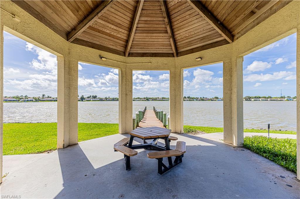 7761 Jewel Lane, Unit 202 Naples, FL 34109 - Photo 25 of 27 View of patio / terrace with a water view and a gazebo