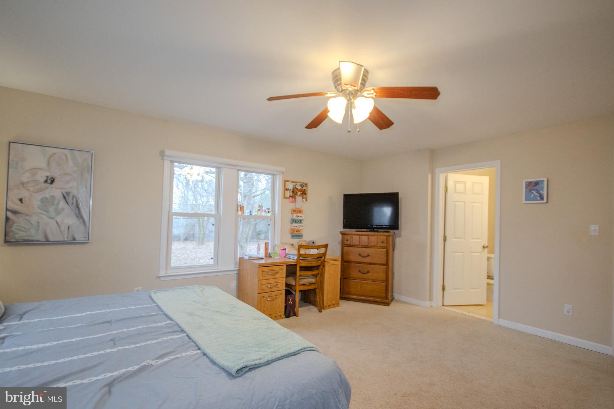 101 Culver Street Hebron, MD 21830 - Photo 18 of 33 a bedroom with furniture and a flat screen tv