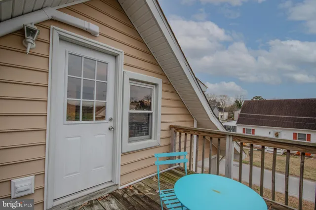a balcony with a potted plant on it