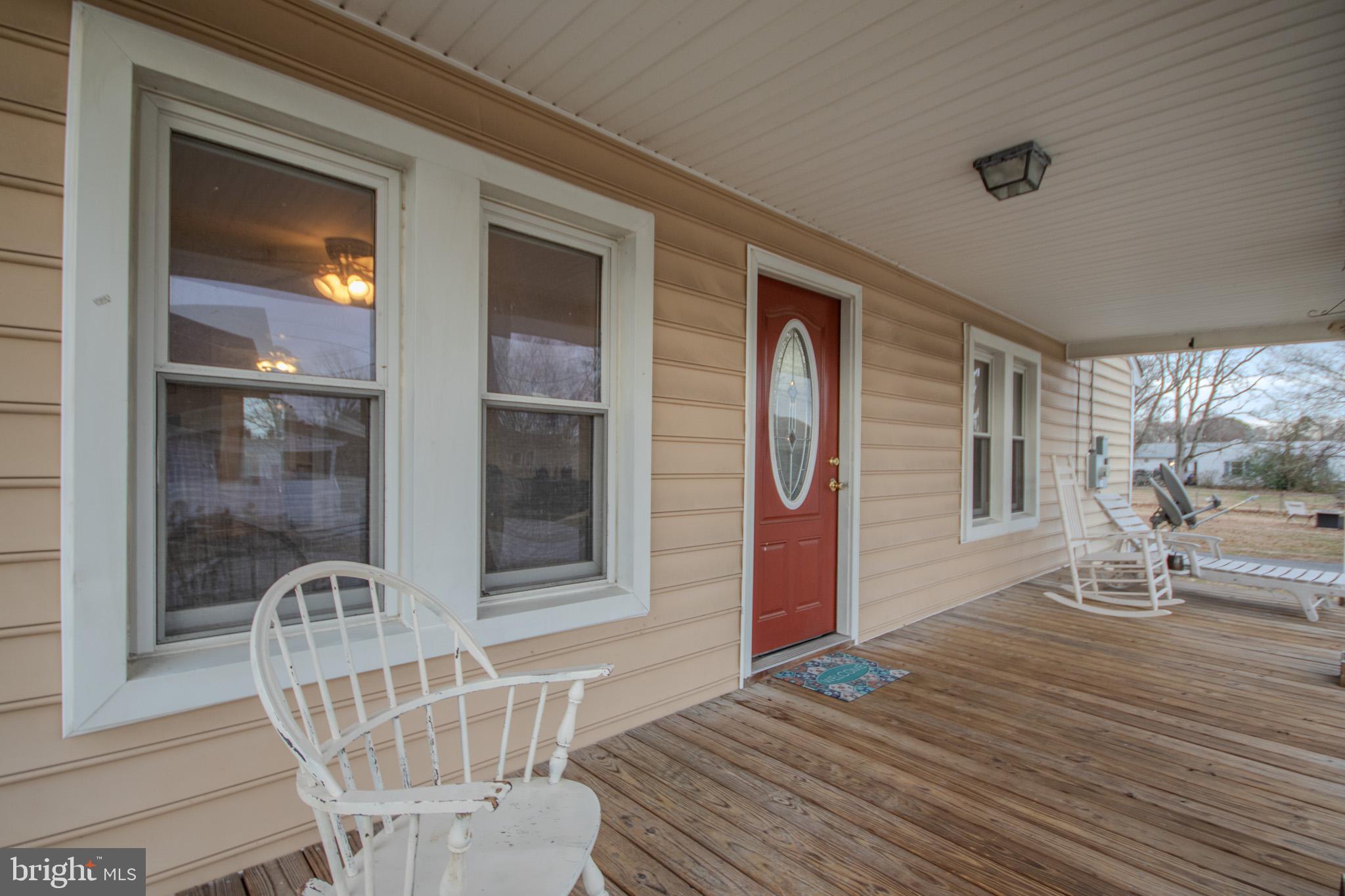 101 Culver Street Hebron, MD 21830 - Photo 5 of 33 a balcony with table and chairs