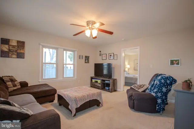 a bedroom with furniture and a fireplace