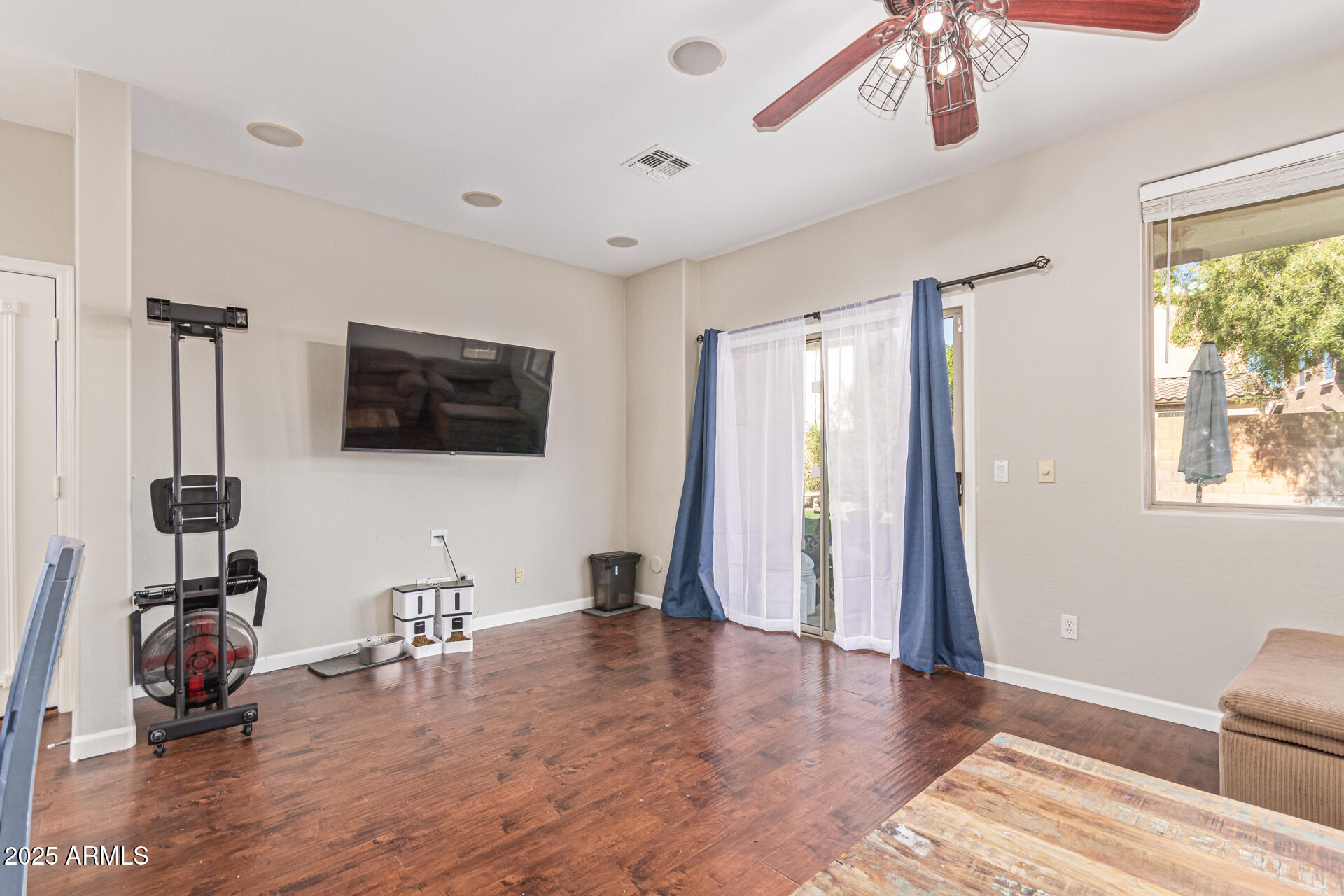 3802 East Chickadee Road Gilbert, AZ 85297 - Photo 8 of 29 a view of a livingroom with wooden floor and windows