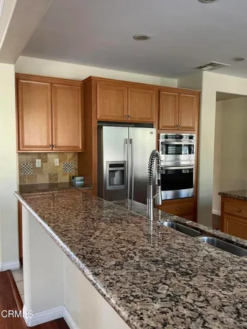 a room with gym equipment and windows