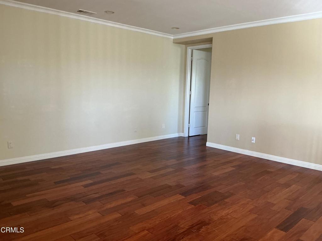 13687 Blue Ridge Way Moorpark, CA 93021 - Photo 25 of 56 a view of an empty room with wooden floor