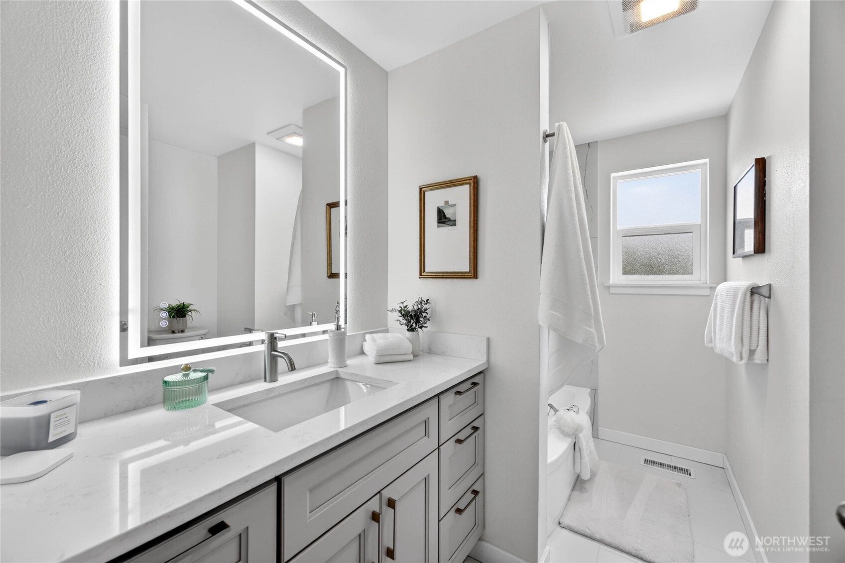 9114 207th Place Southwest Edmonds, WA 98026 - Photo 19 of 36 a bathroom with a sink and mirror with toilet