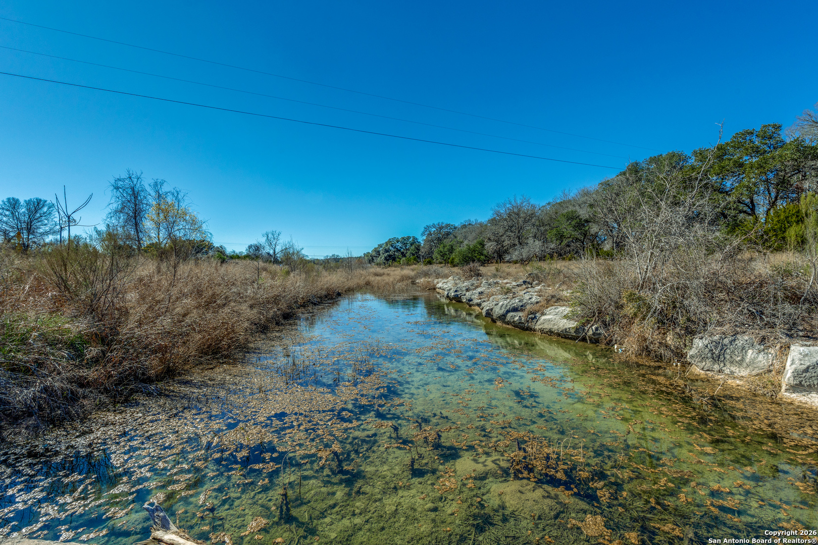 330 Waring Welfare Road Boerne, TX 78006 - Photo 8 of 13 a view of a lake with mountains in the background