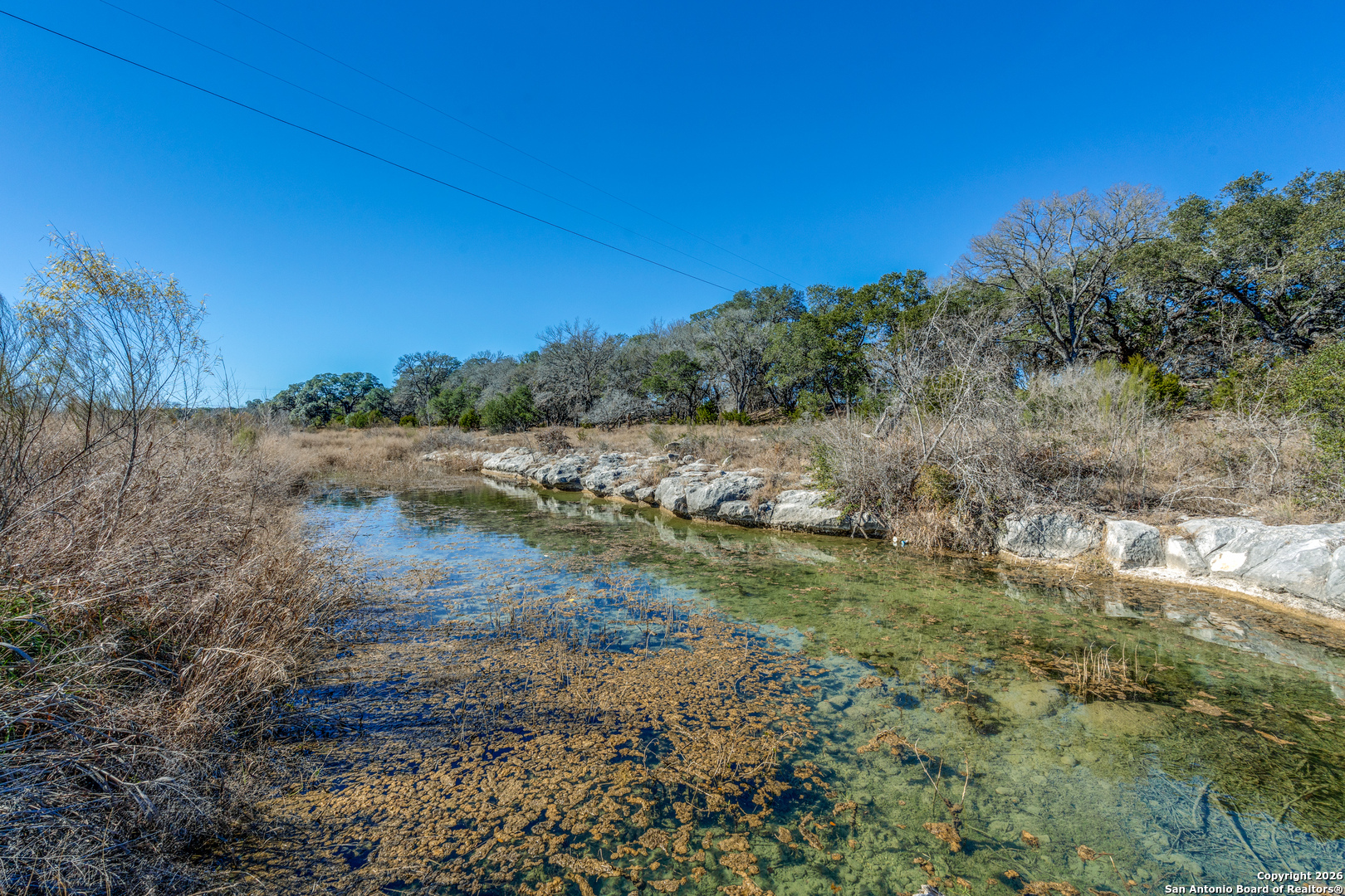 330 Waring Welfare Road Boerne, TX 78006 - Photo 9 of 13 a view of a lake with mountains in the background