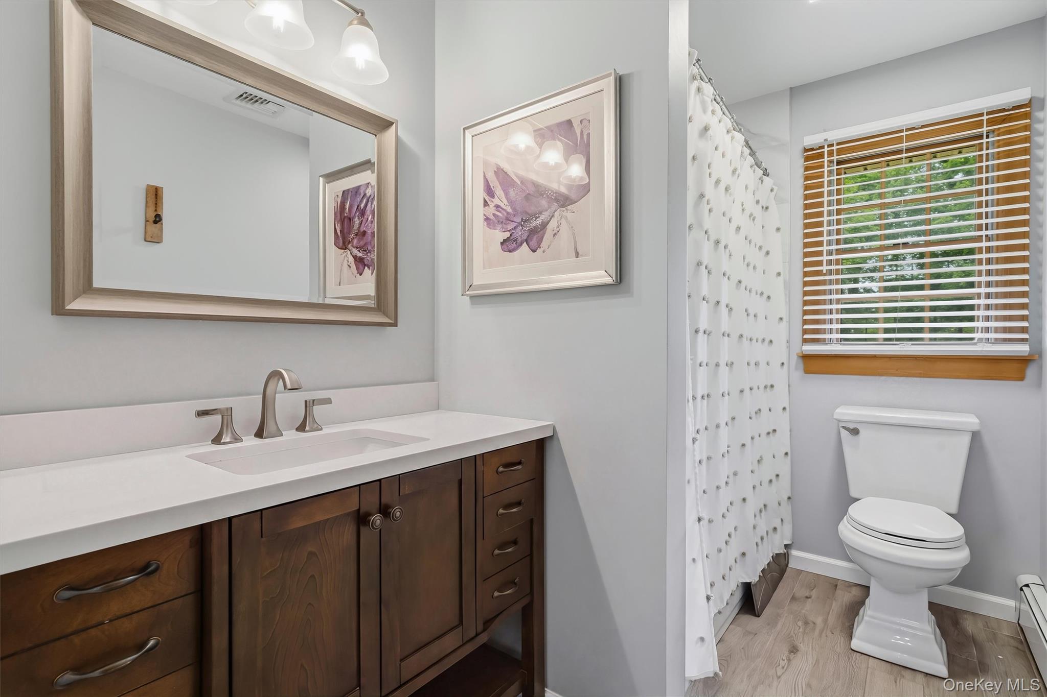 318 Beattie Road Washingtonville, NY 10992 - Photo 21 of 42 a bathroom with a toilet a sink and a mirror
