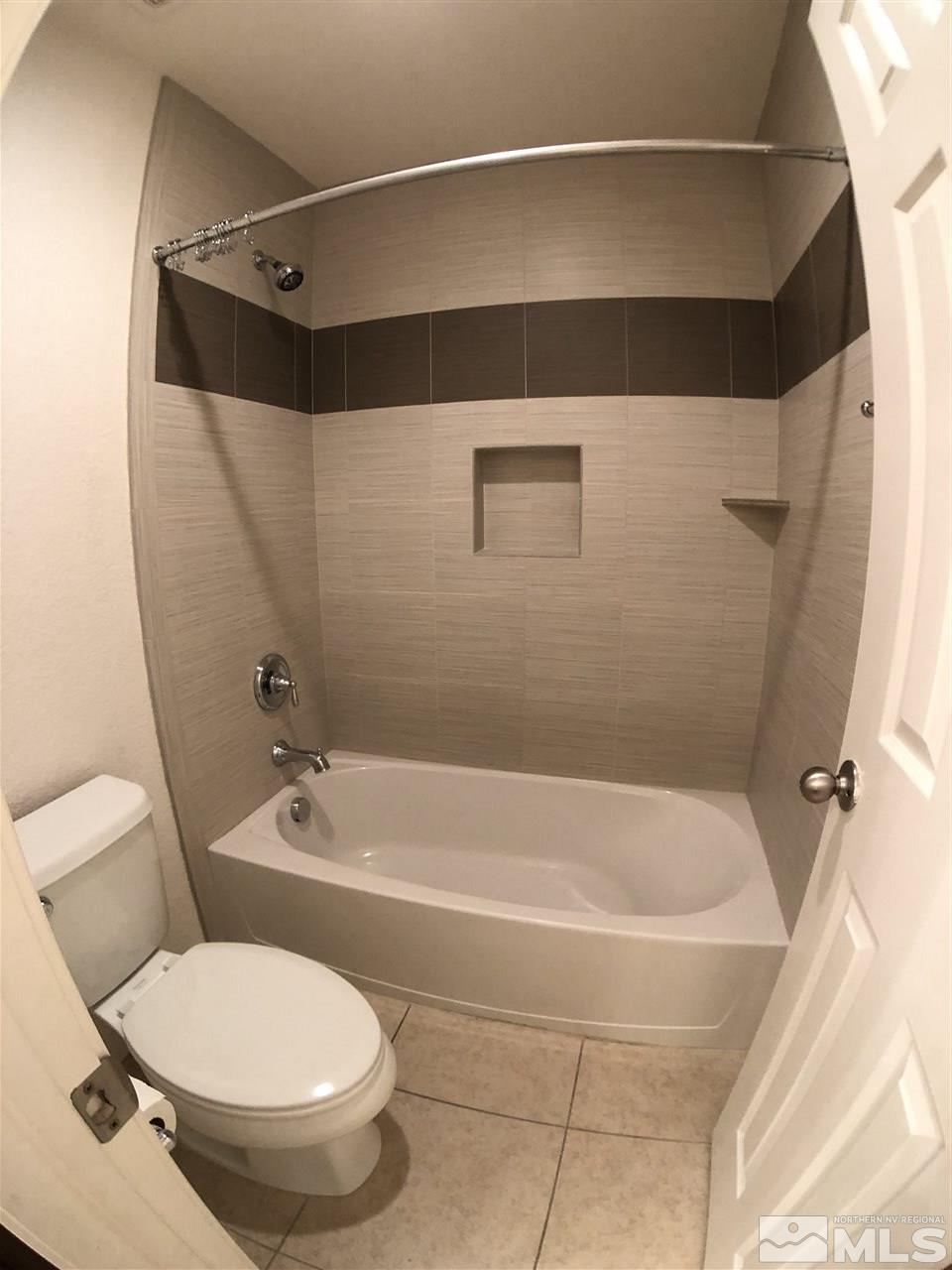 2035 Angel Ridge Drive Reno, NV 89521 - Photo 15 of 23 a bathroom with a toilet and a bathtub