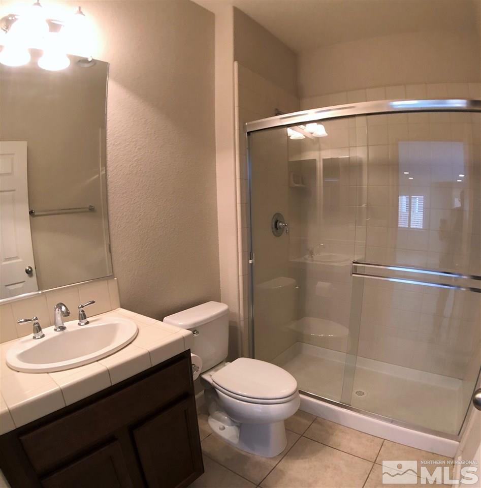 2035 Angel Ridge Drive Reno, NV 89521 - Photo 8 of 23 a bathroom with a sink toilet and shower